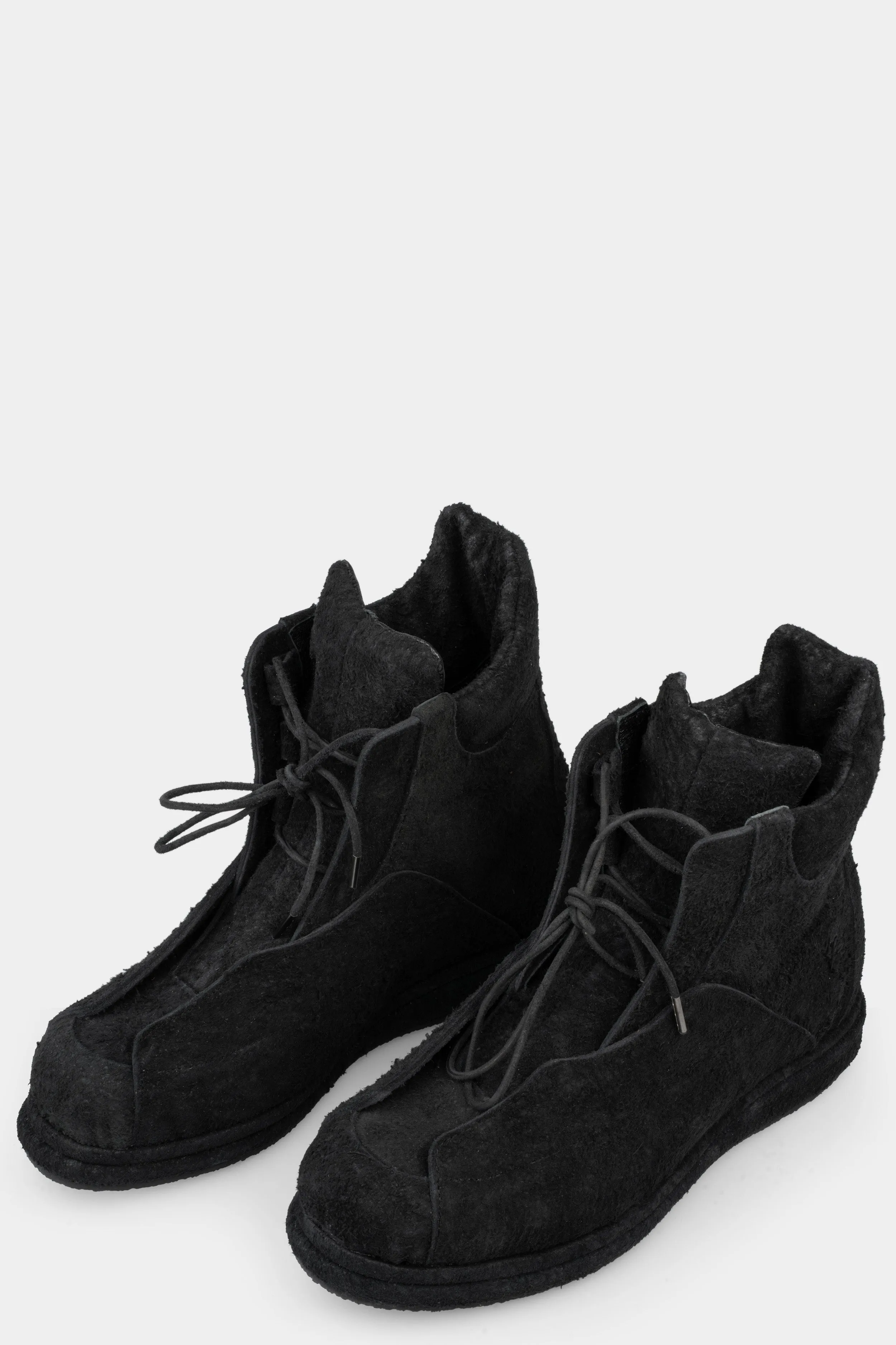 Distressed suede wing boots