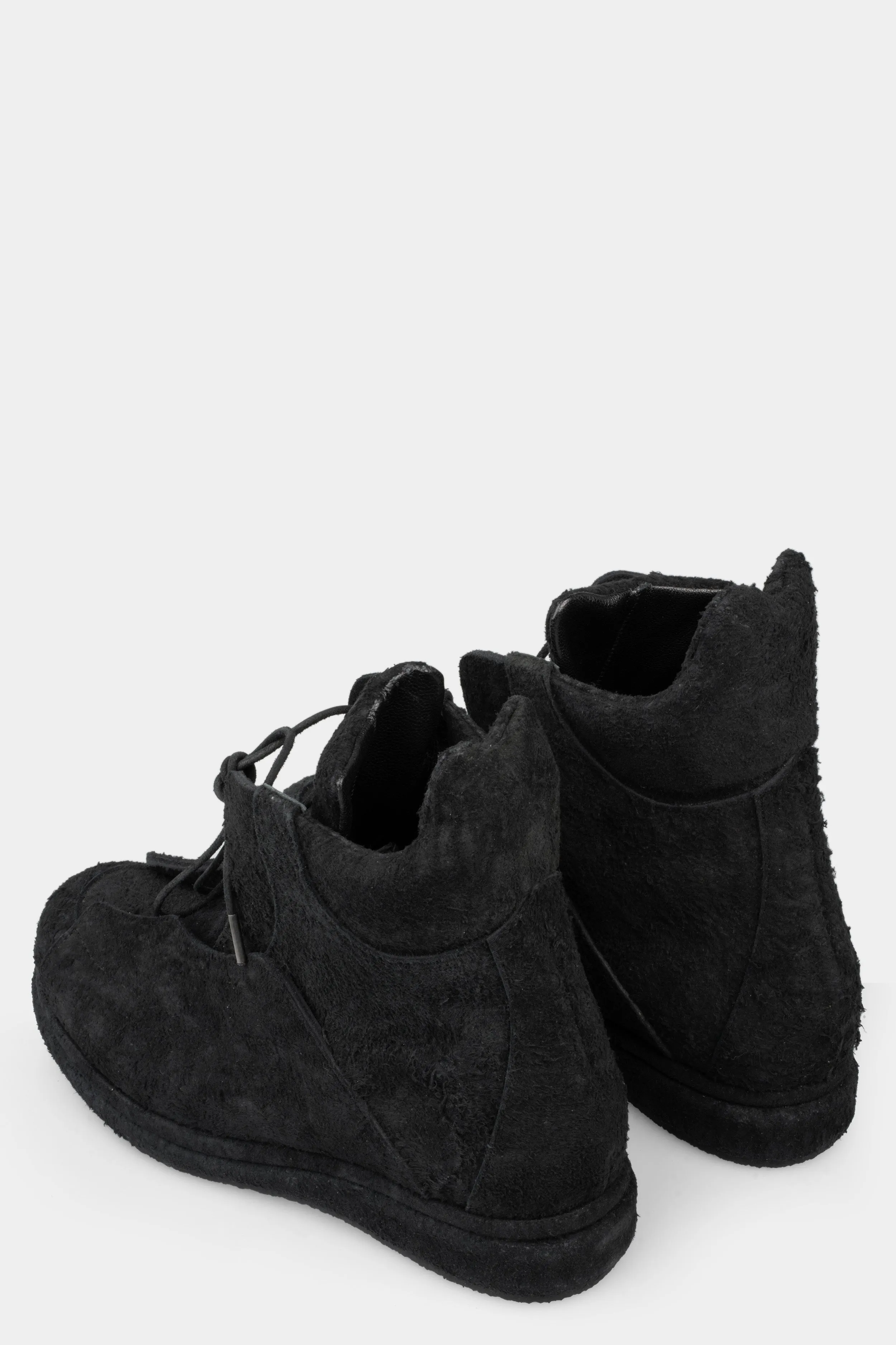 Distressed suede wing boots